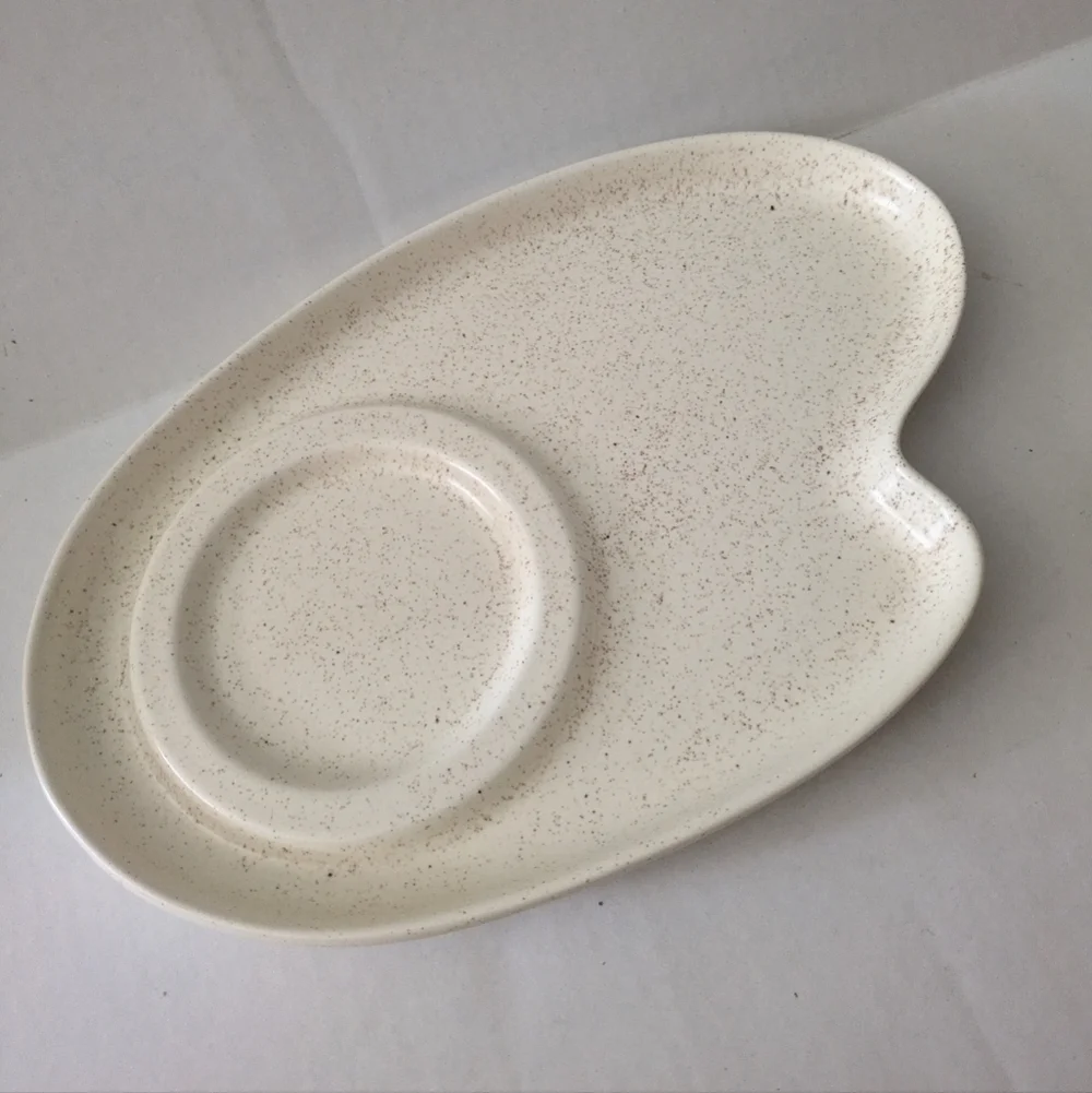 Retro speckled ceramic platter chip and dip.